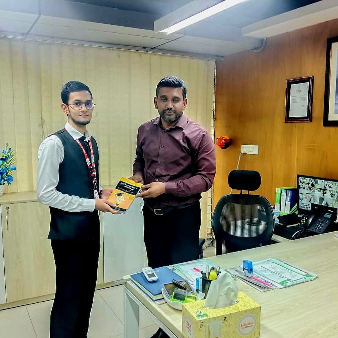 Presenting book to bank manager at NRBC Bank IELTS seminar